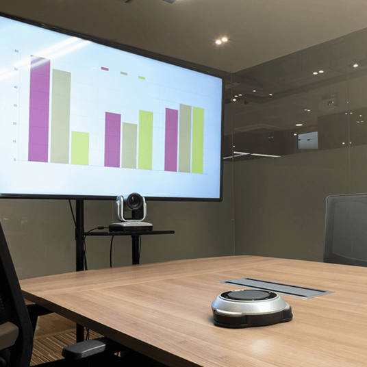 Atiroh PTZ camera setup in a modern meeting room for seamless communication and real-time video collaboration.