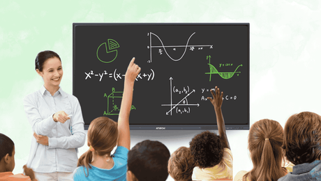 Children raising hands in a classroom with an interactive digital panel displaying math and graphs.