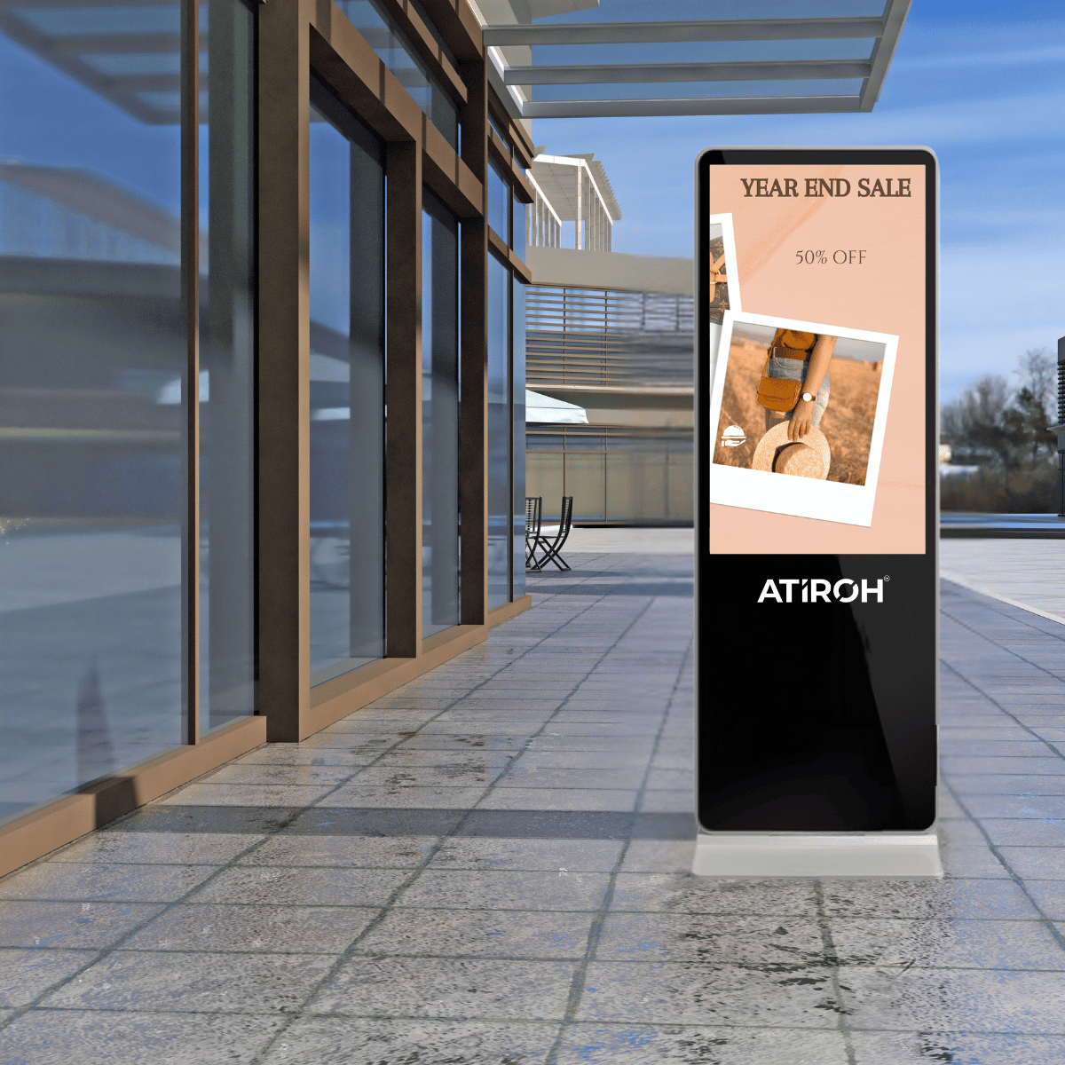 Atiroh outdoor digital kiosk displaying a year-end sale advertisement in front of a building, ideal for retail promotions and brand marketing.